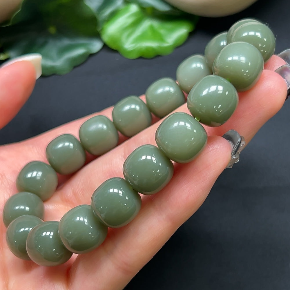 HKHQ Hetian Jade bracelet with 11.8mm beads, weighing approximately 49.28g, showcasing smooth, polished jade stones.