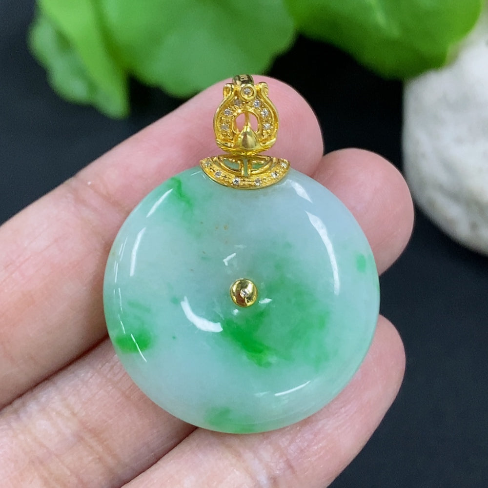 Jadeite Peace Knot pendant with 18K gold clasp and diamond accents, featuring smooth green jade and intricate design.
