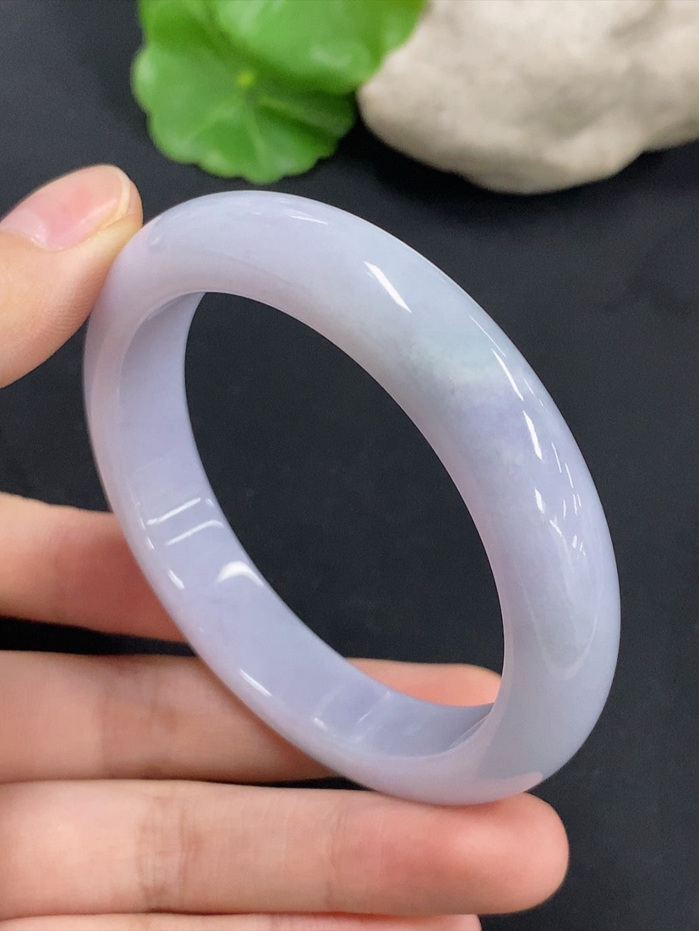 Jadeite round bangle with size 55.1, weighing approximately 55.82g, showcasing smooth, polished green jade from HKHQ.