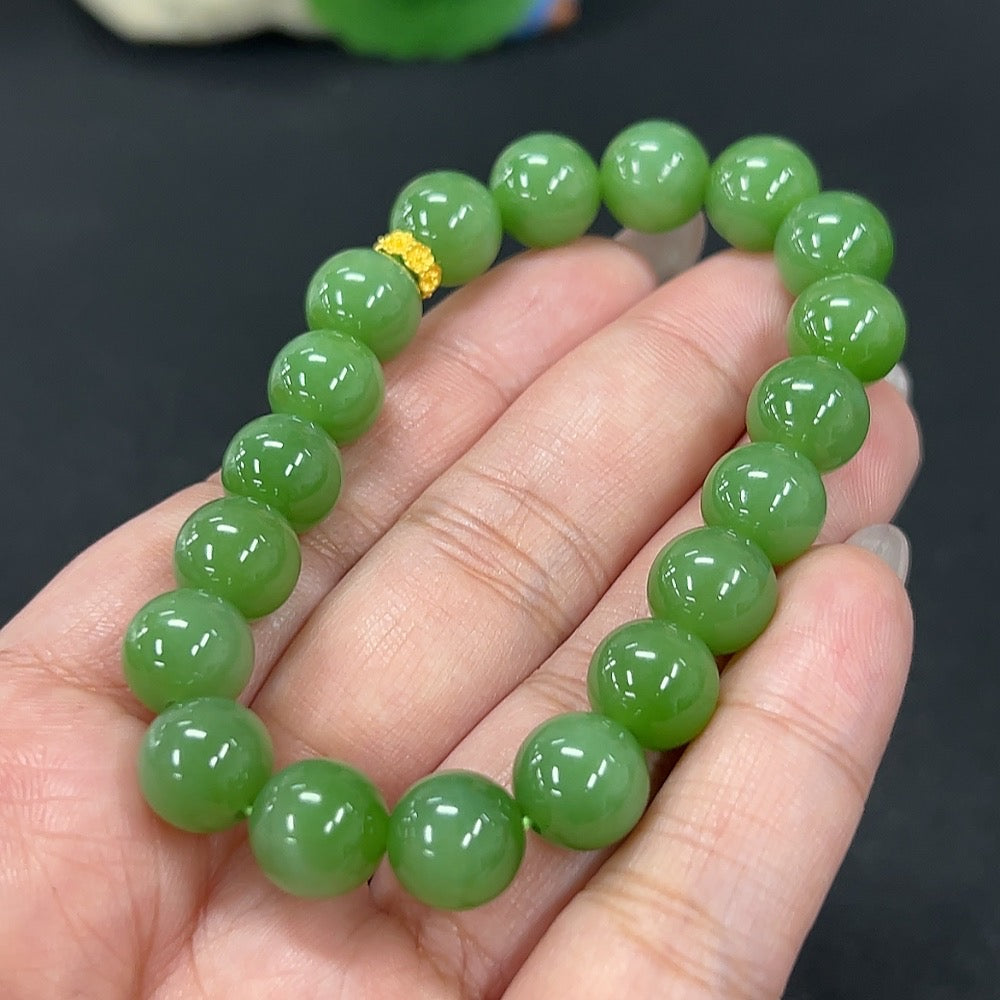 HKHQ Hetian jade bracelet, approx. 9.6mm beads, total weight 30.1g, showcasing smooth, polished green jade stones.