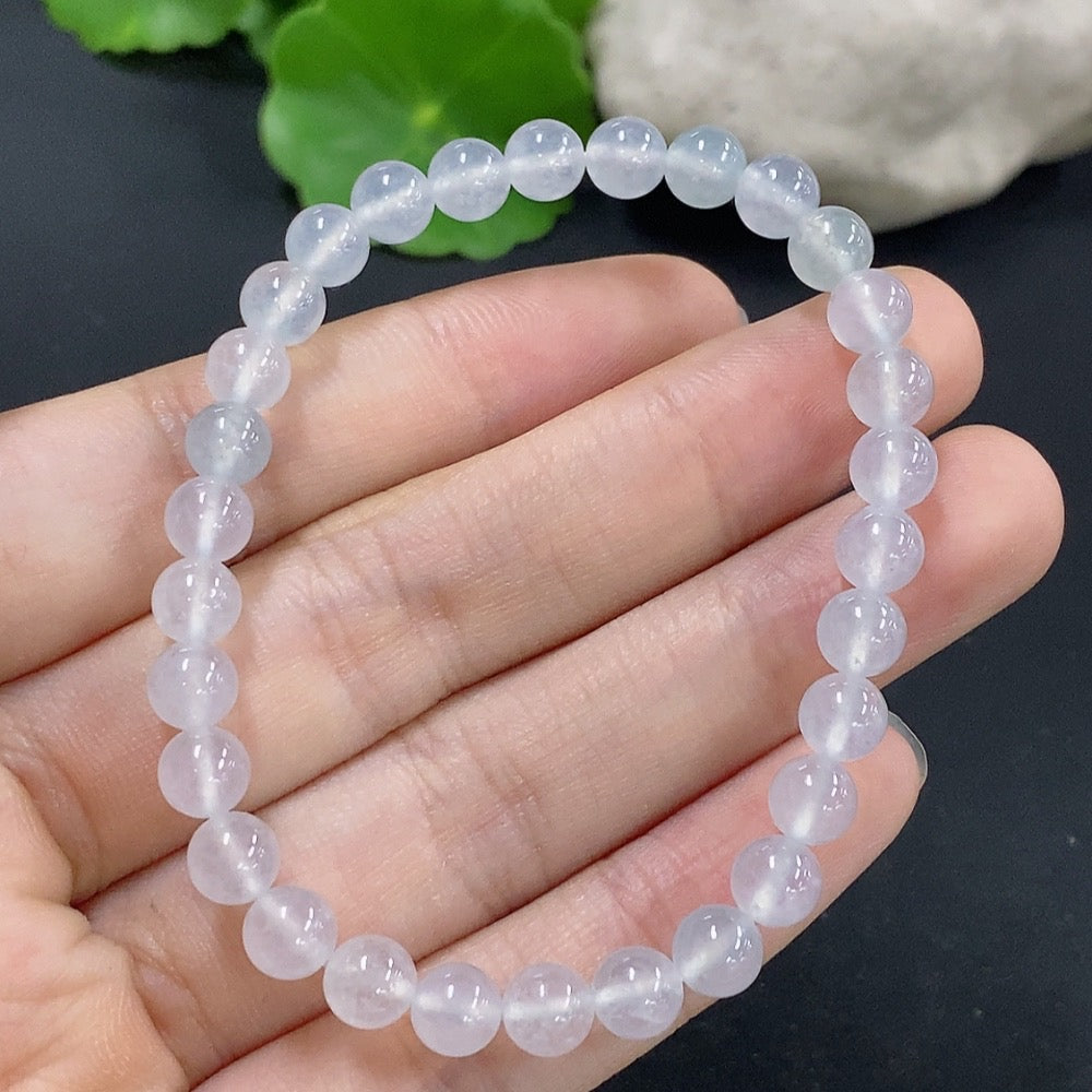 Jadeite bracelet with 5.9mm beads, HKHQ brand, featuring smooth green jade stones and a polished finish.