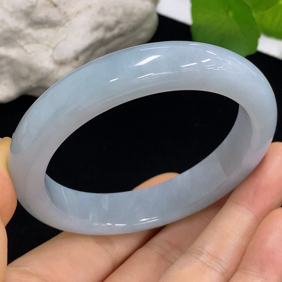HKHQ jadeite round bangle in size 56.7, weighing 61.15g, showcasing smooth, polished green jadeite bracelet with a rounded shape.