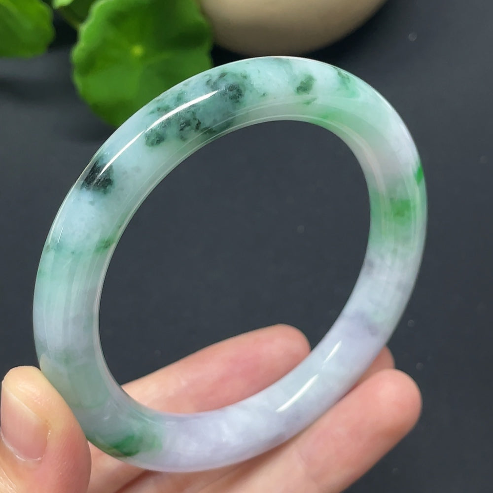 Jadeite round bangle with mineral inclusions, HKHQ brand, size 55, weighing approx. 48.6g, showing repaired section.