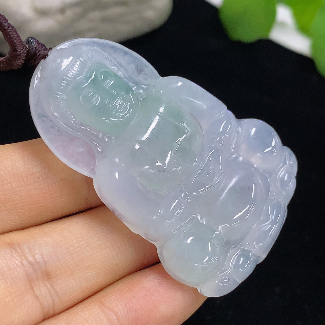 Jadeite Guanyin pendant with rope, crafted from green jade, weighs approximately 21.6g, featuring detailed religious iconography.