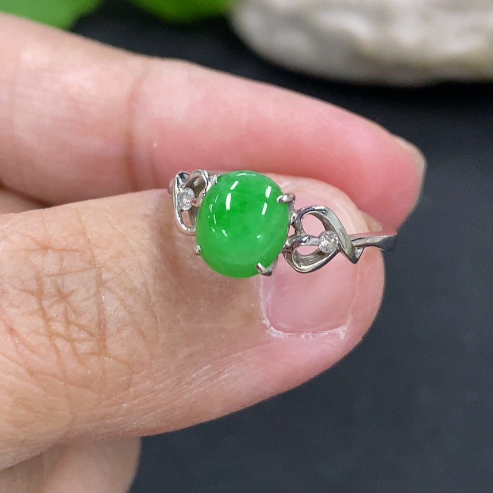 Jadeite cabochon ring with 18k gold setting, size 11.5, featuring a smooth jade stone in a detailed gold band.