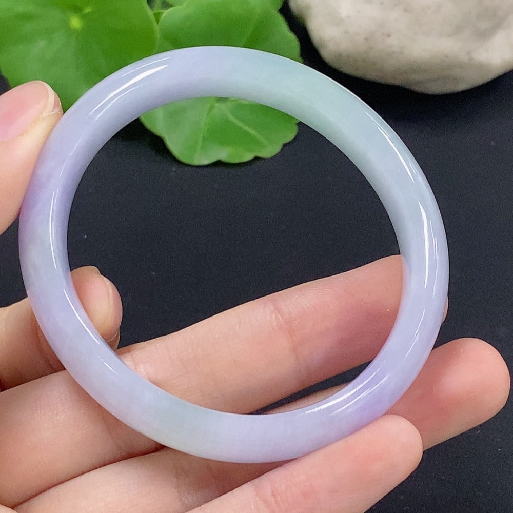 HKHQ jadeite oval bangle in size 50.2, weighing 33.7g, showcasing smooth, polished green jadeite bracelet with oval shape.