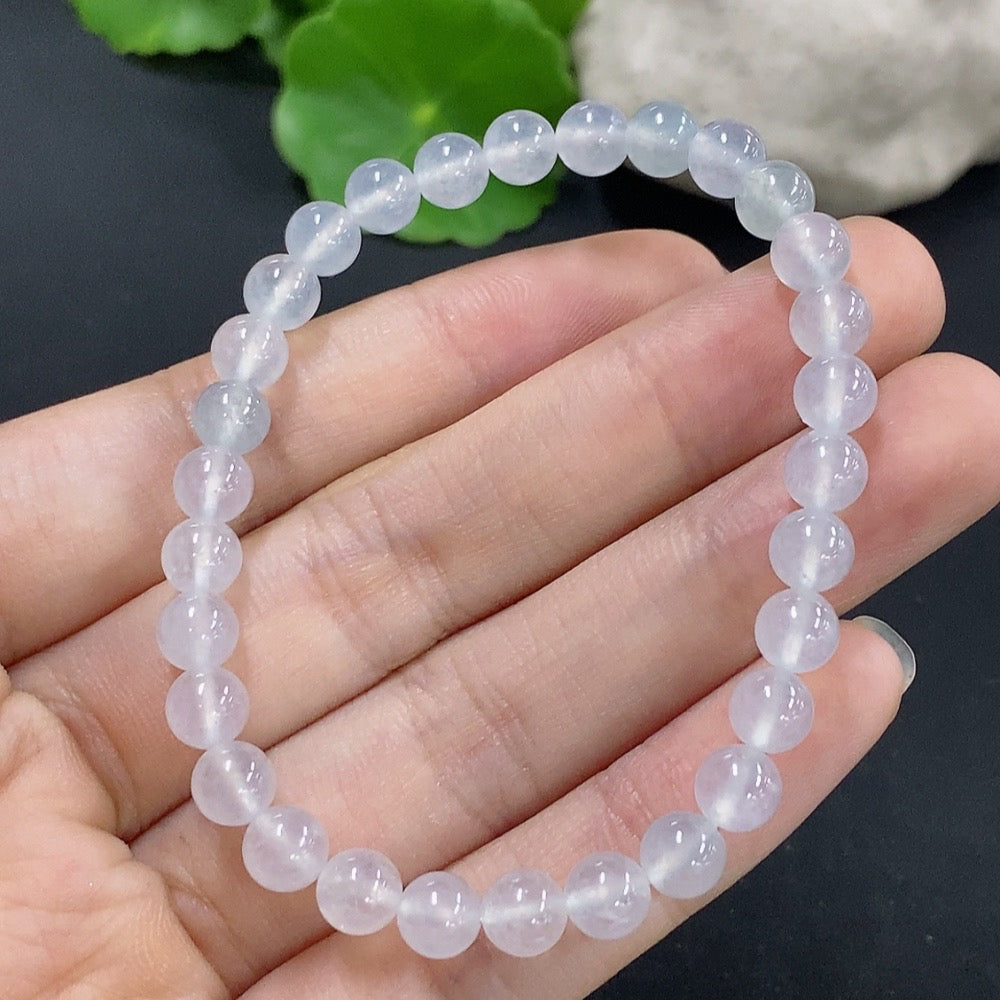 HKHQ jadeite bracelet with 5.9mm beads, weighing approximately 10.8g, showcasing smooth, polished green jade stones.