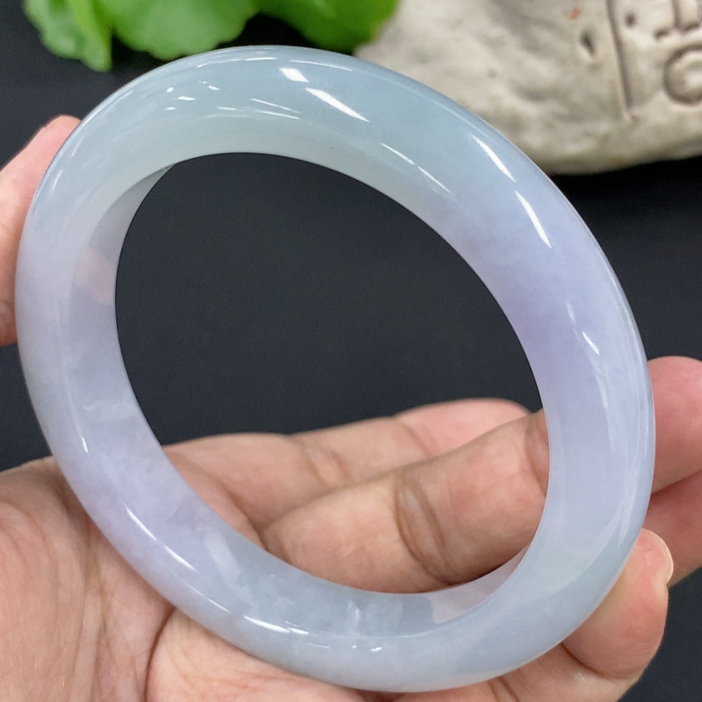 HKHQ jadeite round bangle with 67.3g weight and size 58.7, showcasing smooth, polished jadeite bracelet on a neutral background.