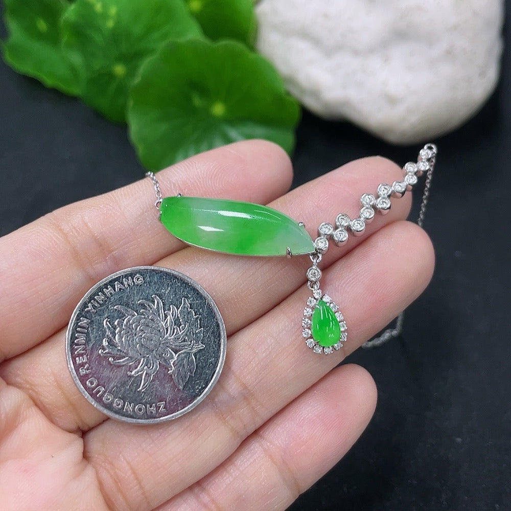 Jadeite pendant with 18K gold and diamond accents on chain, elegant jewelry piece featuring green jade and sparkling details.