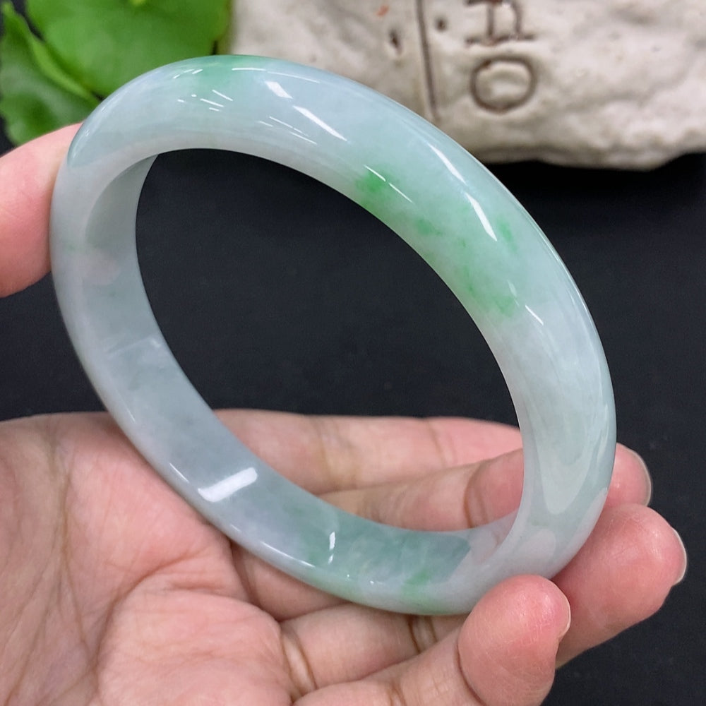 Jadeite round bracelet with HKHQ branding, approximately 59.8g weight and 63.5mm diameter, showcasing smooth, polished jade stones.