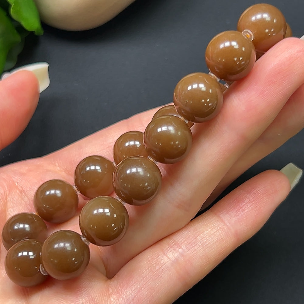 Heitian jade bracelet with 12.1mm beads and approx. 43.69g weight, showcasing smooth, polished green jade stones.