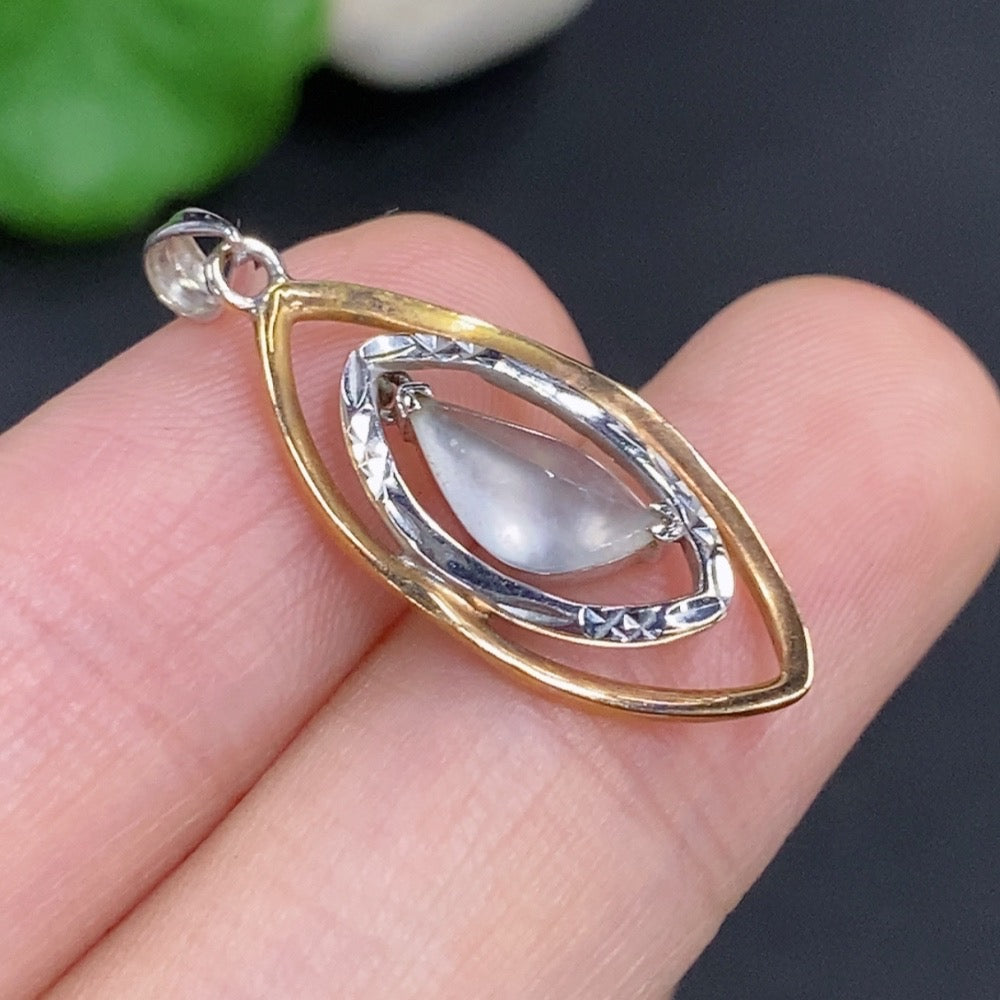 Jadeite inlaid pendant on a necklace with 18k gold setting, weighing approximately 1.75g, displayed against a neutral background.