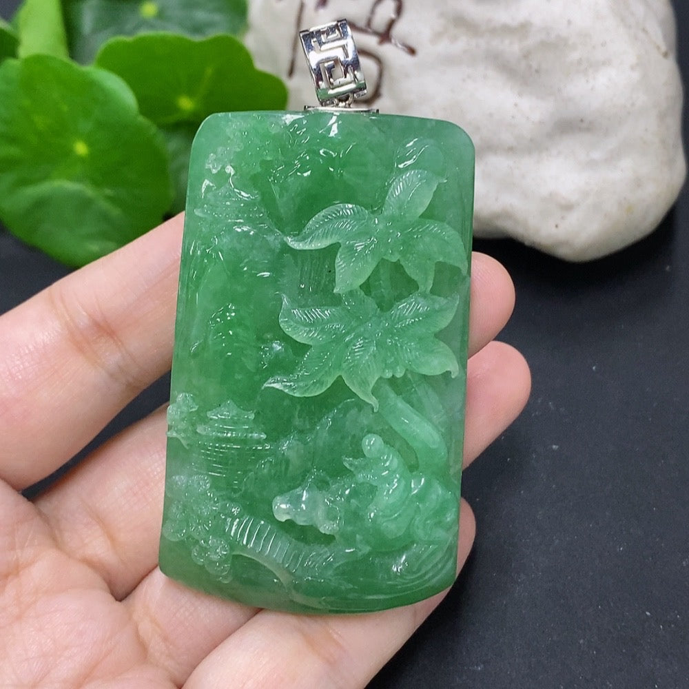 Jadeite landscape pendant with unmarked 18k gold clasp, featuring detailed jade design and weighing approximately 75.5g.