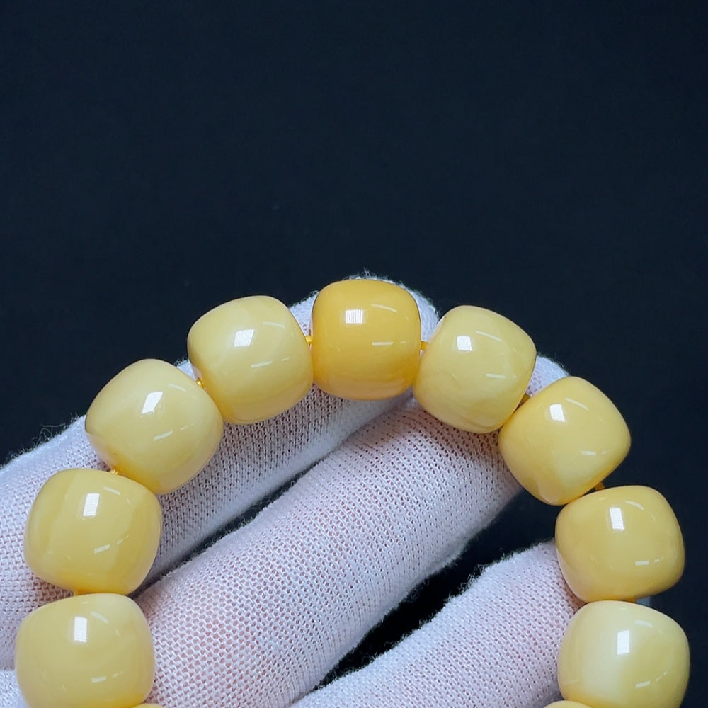 Amber Beeswax bracelet by HKHQ featuring natural amber beads, approximately 13.8mm in size, totaling around 22.64g.