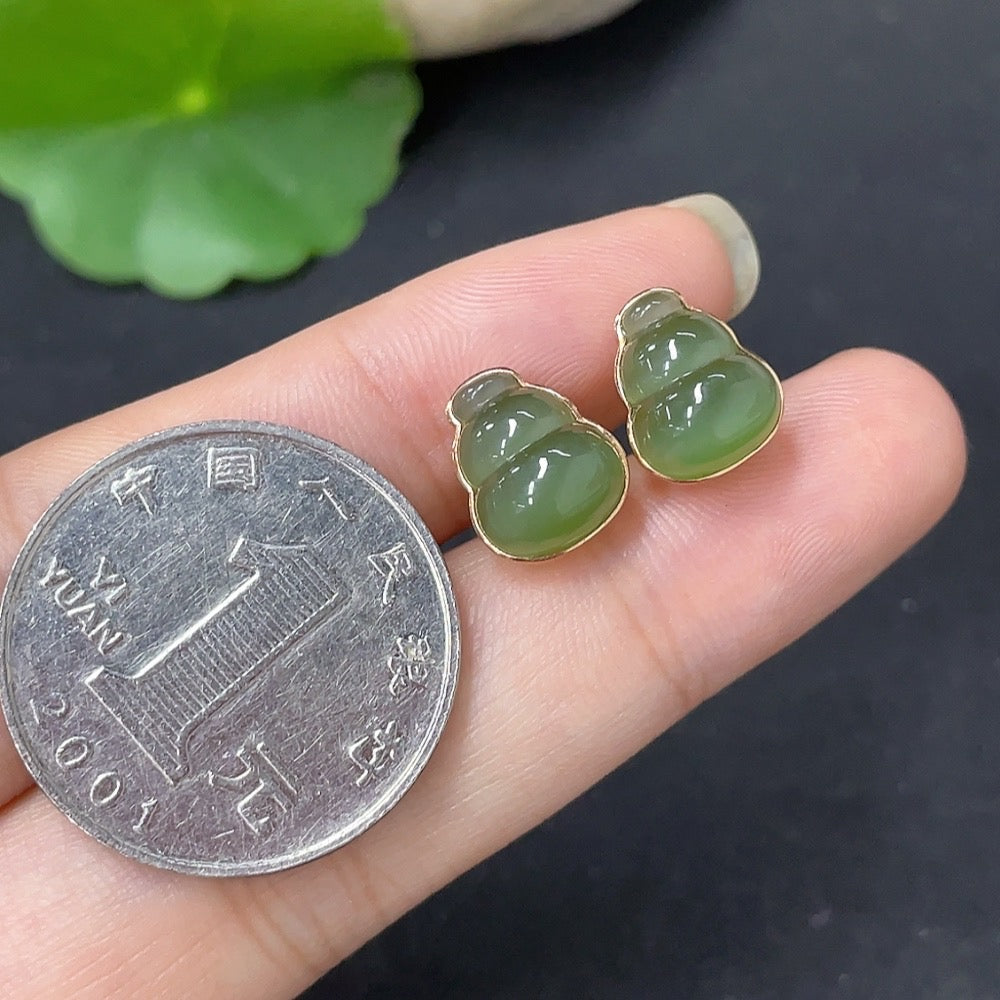 HKHQ Hetian Jade inlaid earrings with 18k gold, featuring elegant jade stones and ear stoppers, total weight 2.2g.