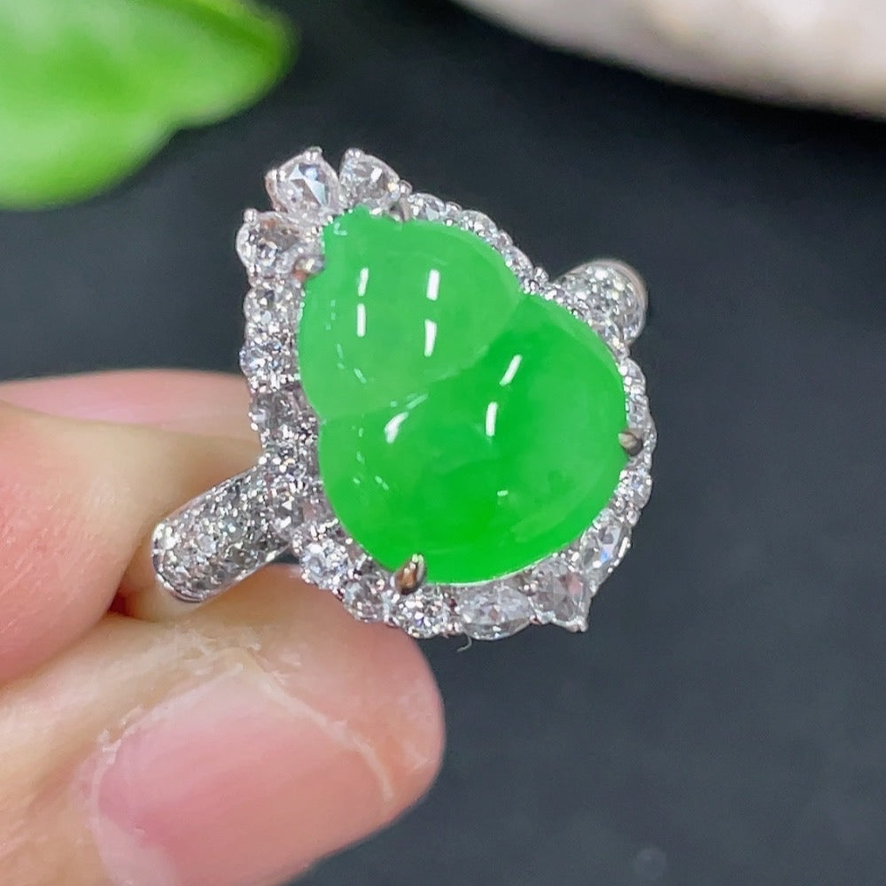 HKHQ jadeite gourd ring with 18K gold setting and diamond inlay, showcasing intricate craftsmanship and elegant design.