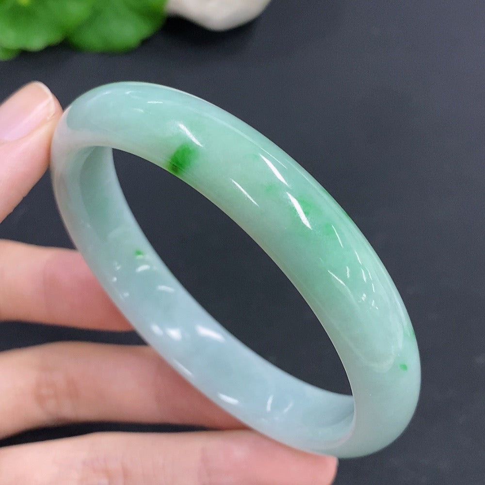 HKHQ jadeite round bangle with a 59.5mm size, weighing approximately 46.8g, showcasing smooth, polished jade surface.