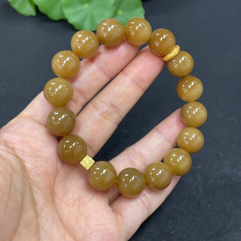 Hetian jade bead bracelet with 11.7mm jade beads, non-gold, weighing approximately 43.7g, featuring HKHQ branding.