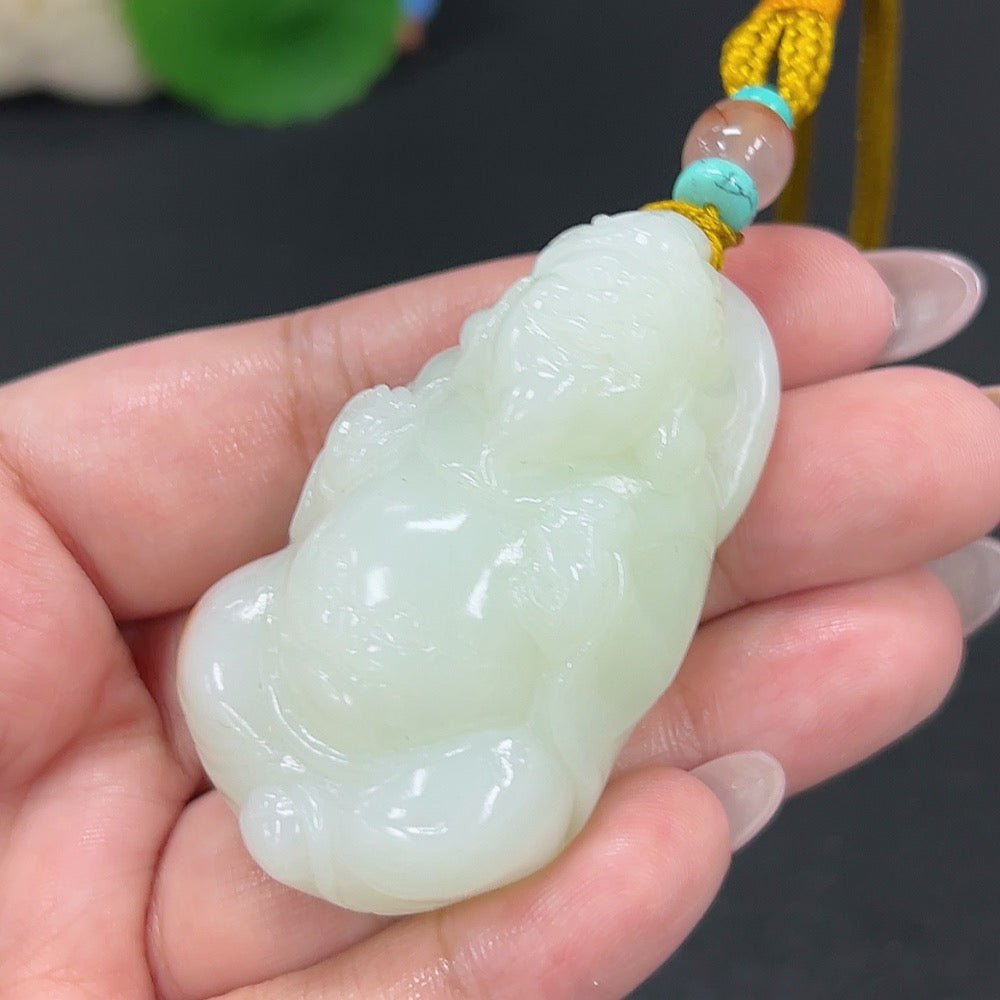 Hetian jade pendant featuring the God of Wealth, carved from green jade with a detailed figure, weighs approximately 64.7g with rope.