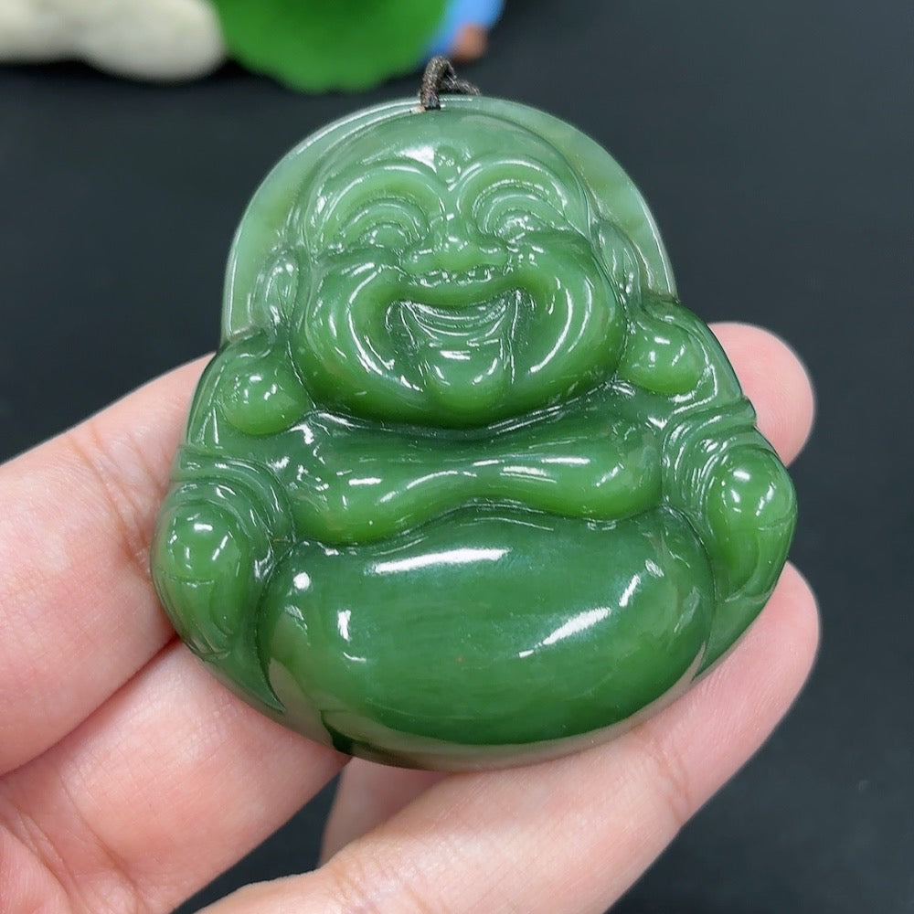 Hetian jade Buddha pendant with rope, weighing approximately 58.6g, showcasing smooth green jade craftsmanship.