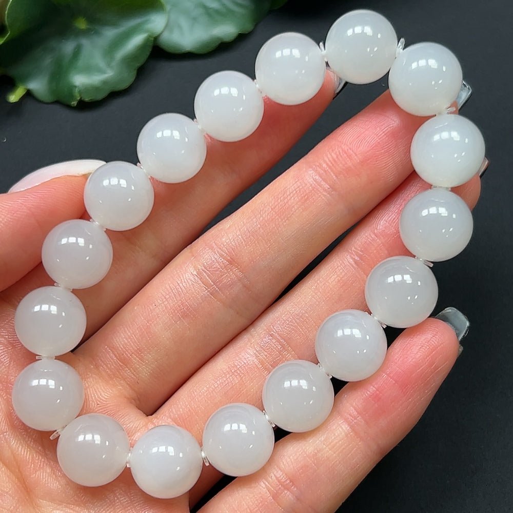 HKHQ Hetian jade bracelet with 11.9mm beads, weighing approximately 44.52g, featuring smooth, polished green jade stones.
