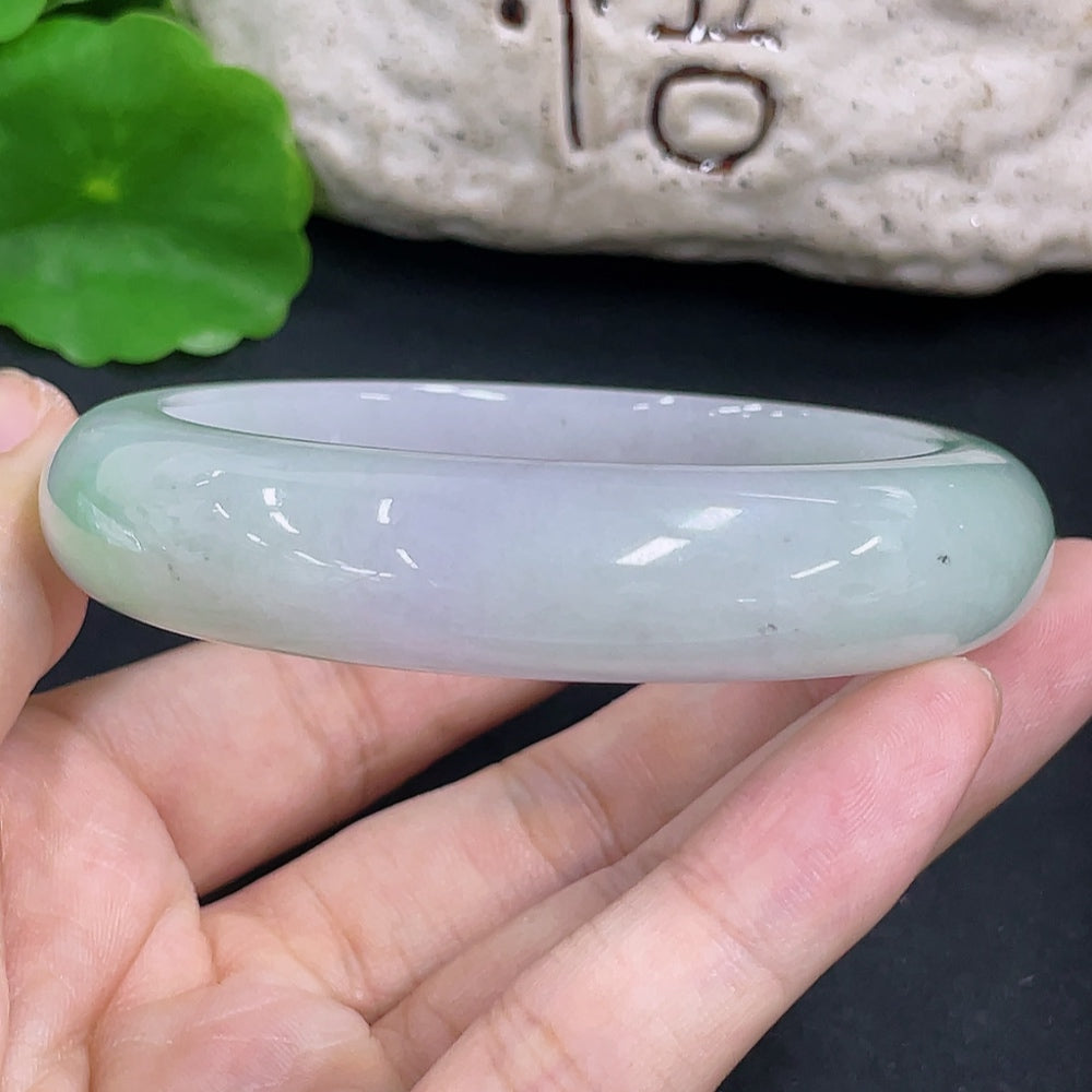 Round jadeite bangle with a 58mm size and 72g weight, showcasing smooth, polished jade jewelry by HKHQ.