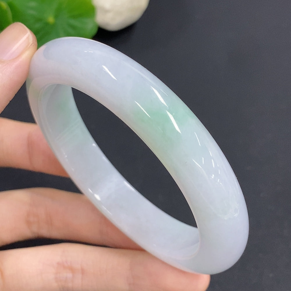 Jadeite round bangle with a size of 58.7, weighing approximately 68.3 grams, crafted by HKHQ, showcasing smooth, polished jade jewelry.