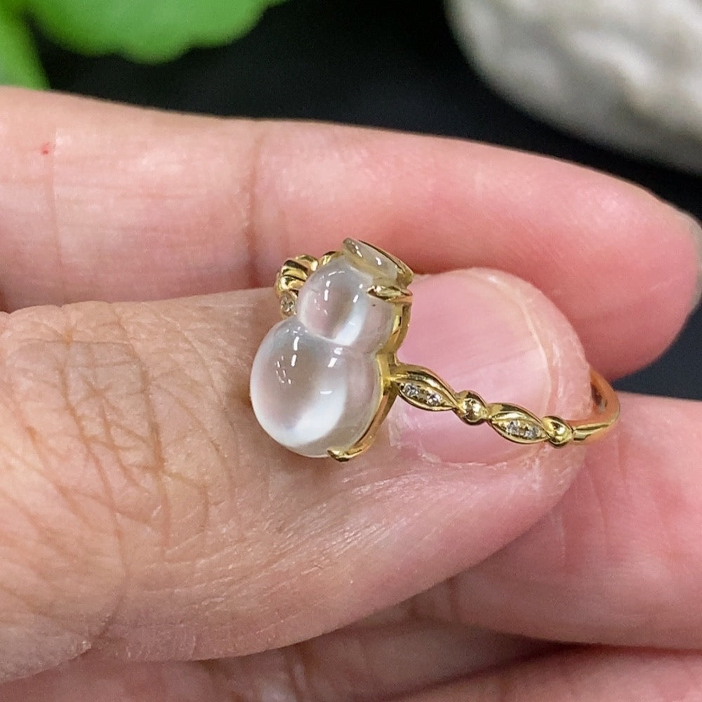 Jadeite gourd ring with 18K gold band from HKHQ, showcasing smooth green jadeite stone in a stylish ring design