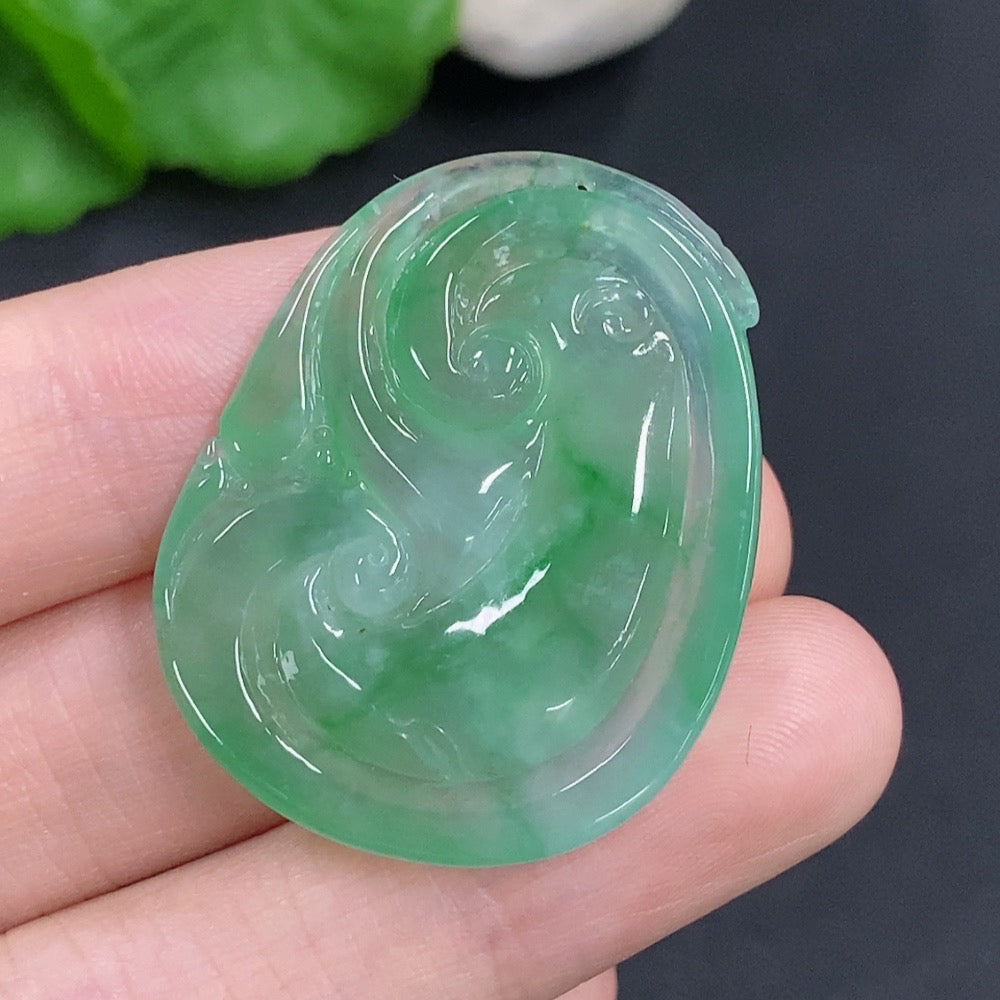 Jadeite Ruyi pendant with intricate carvings, weighing approximately 10.5g, showcasing smooth, polished green jade from HKHQ.
