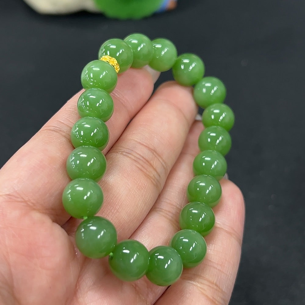 Heitian jade bracelet with 9.6mm beads from HKHQ, showcasing smooth, polished jade stones and a sleek, elegant design.