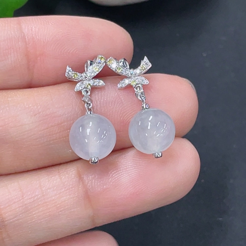 Jadeite earrings set in 18k gold with diamond accents, total product weight approximately 3.07g