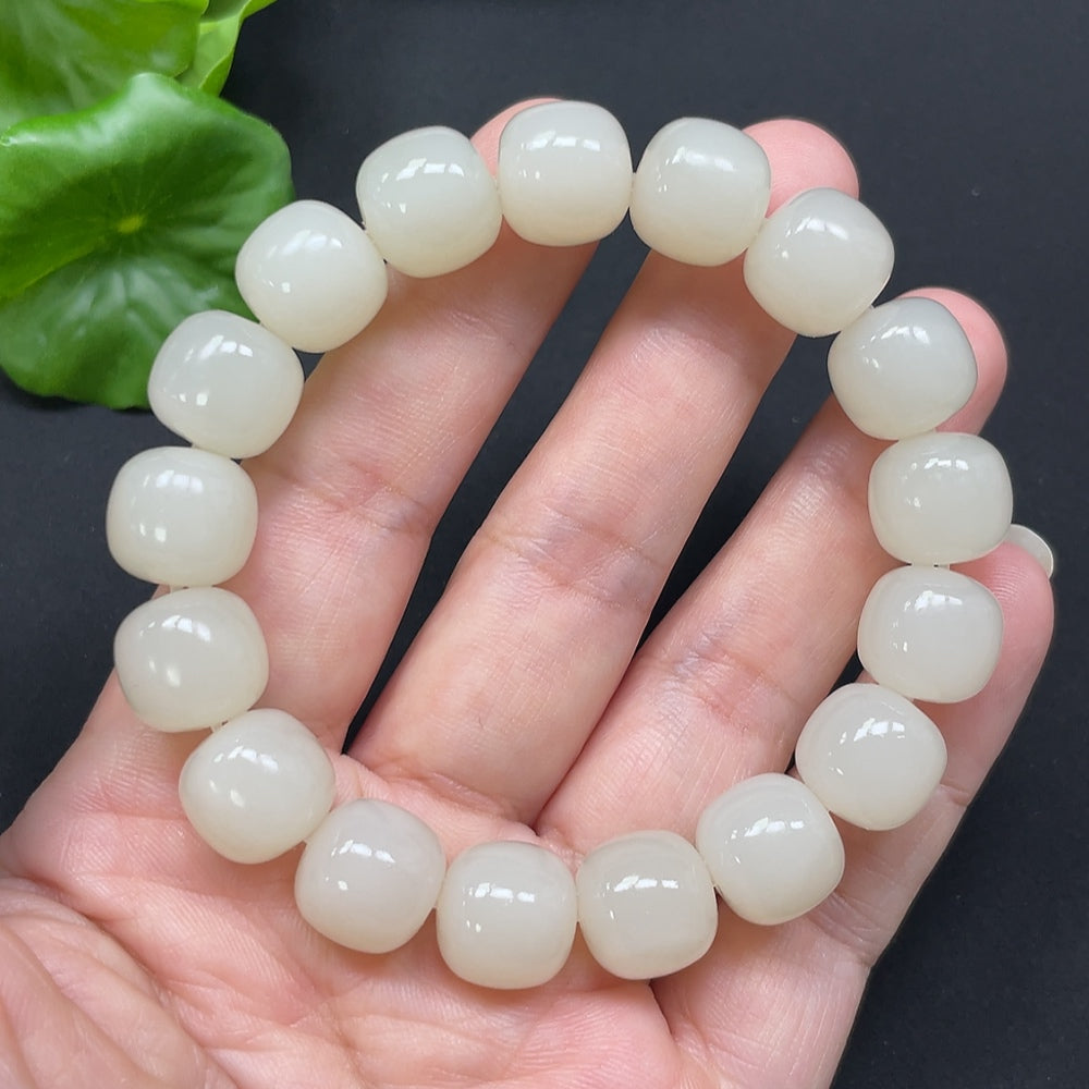 Hetian jade bracelet with 12mm beads, approximately 49.78g, featuring smooth green jade stones from HKHQ.