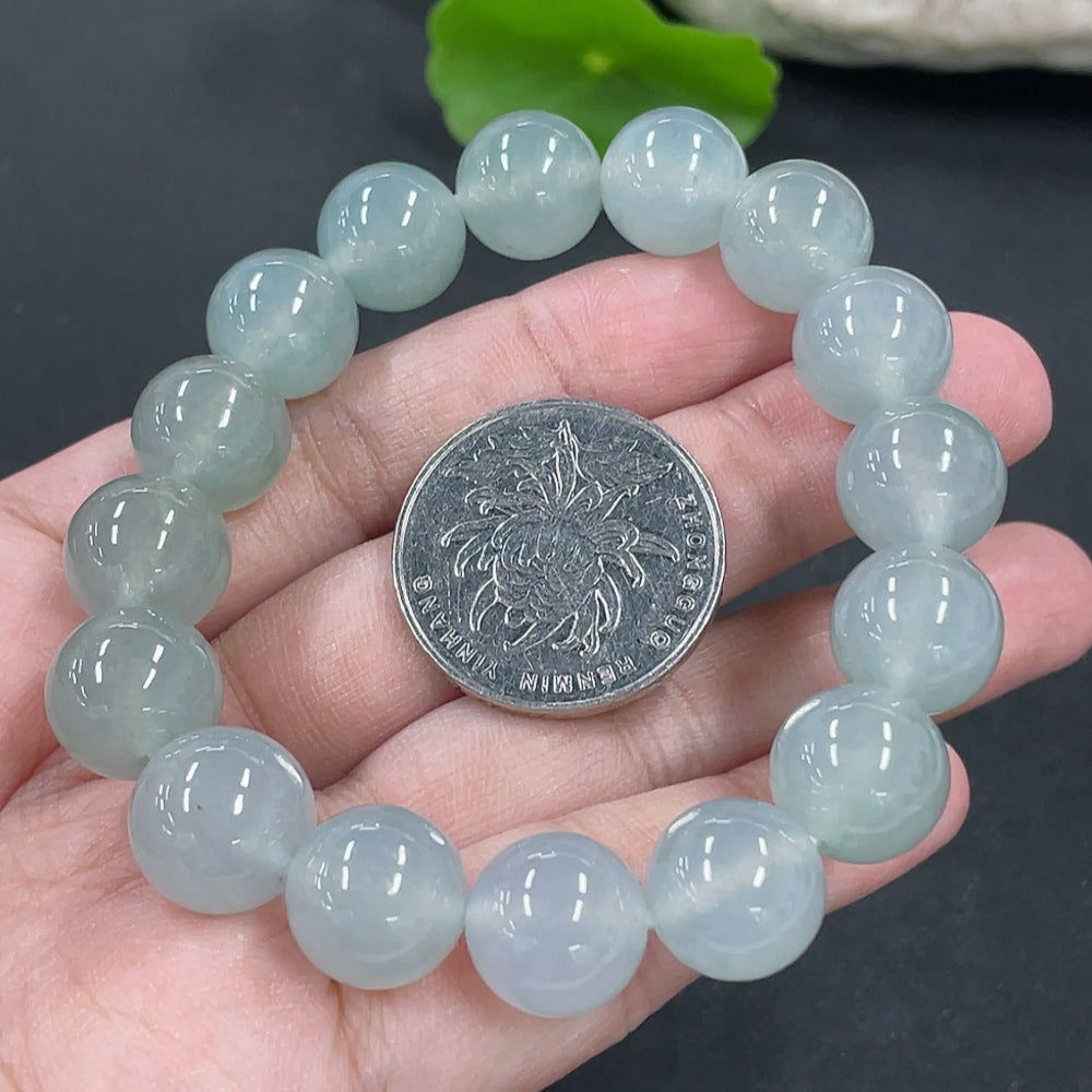 Jadeite bracelet with 12mm beads, crafted from high-quality jade, weighing approximately 47.4g, featuring a smooth, polished finish.