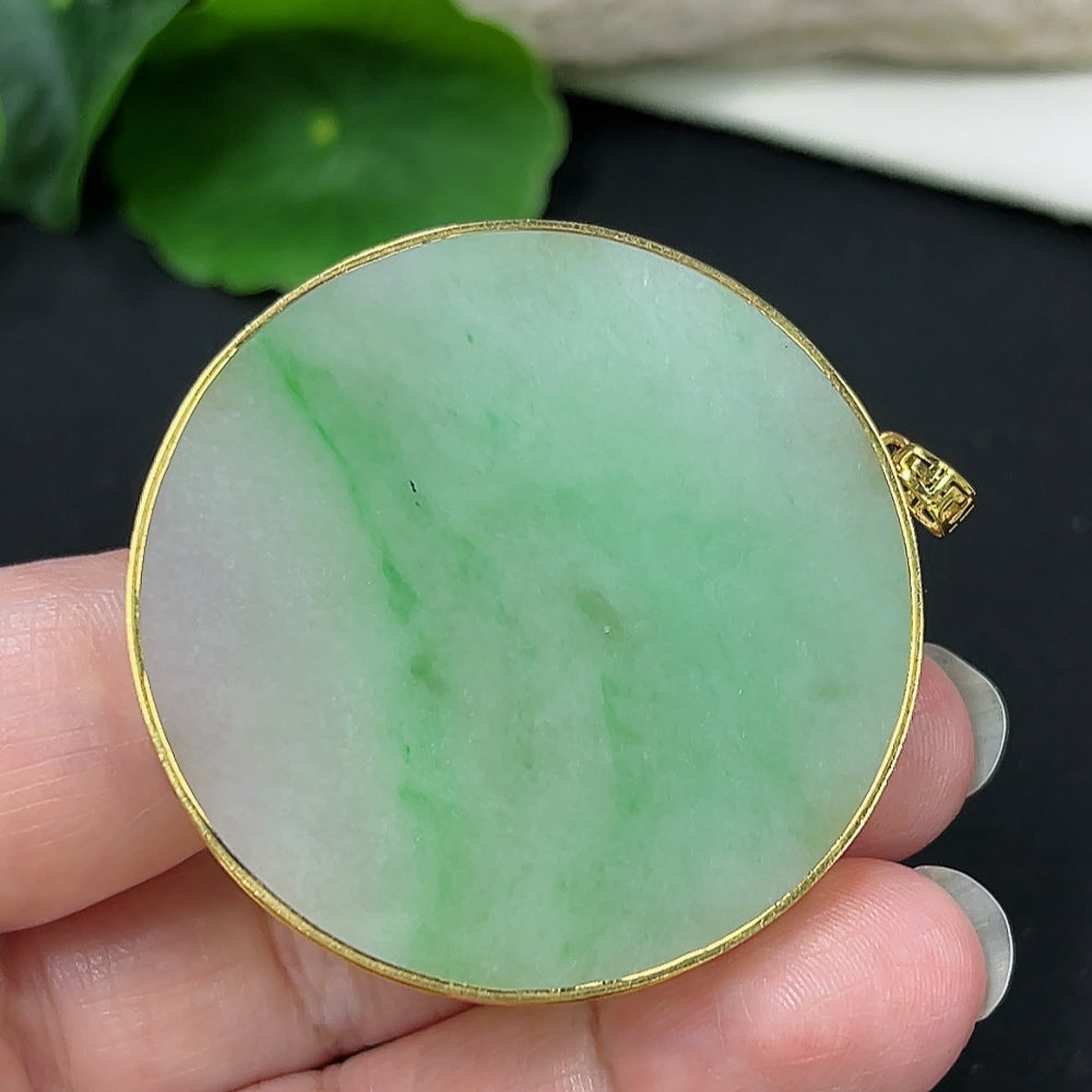 Elegant jadeite pendant necklace with 18K gold setting, featuring a smooth, plain jade stone and a secure gold chain.
