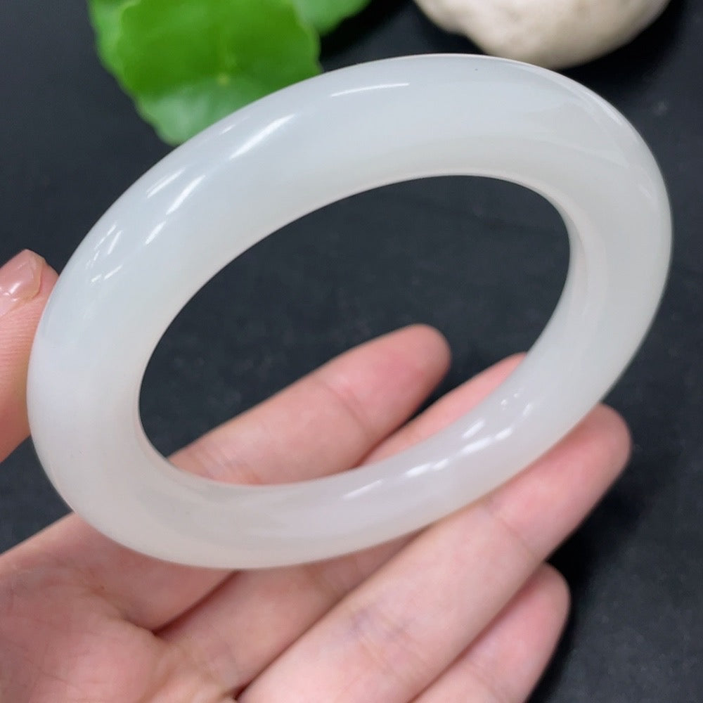 HKHQ Hetian Jade round bangle, size 56.5, weighs approx. 67.3g, crafted from smooth, polished jade showcasing natural green hues.