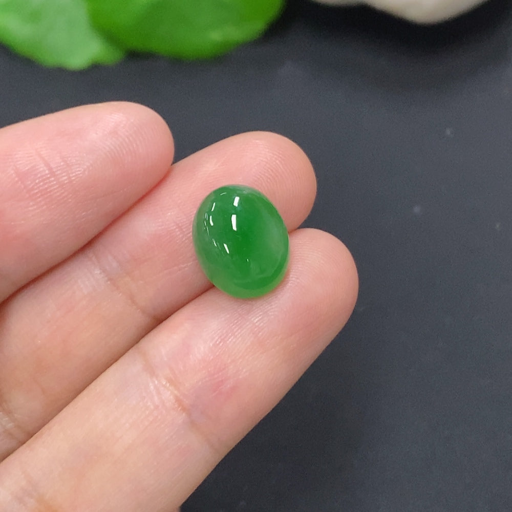 Jadeite cabochon jewelry piece with a smooth, polished surface, weighing approximately 1.1g, displayed against a neutral background