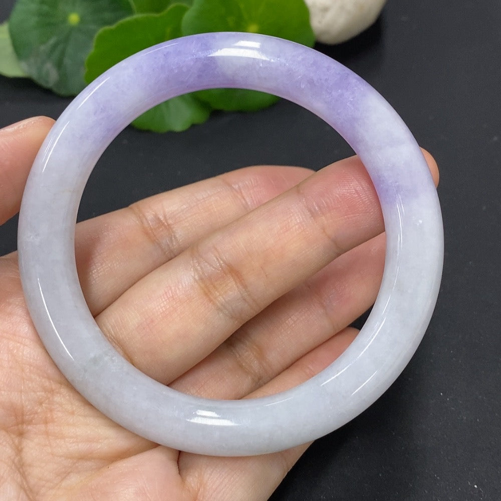 Jadeite round bangle with a 55.8mm diameter, weighing approximately 49.81g, featuring natural mineral components, by HKHQ.
