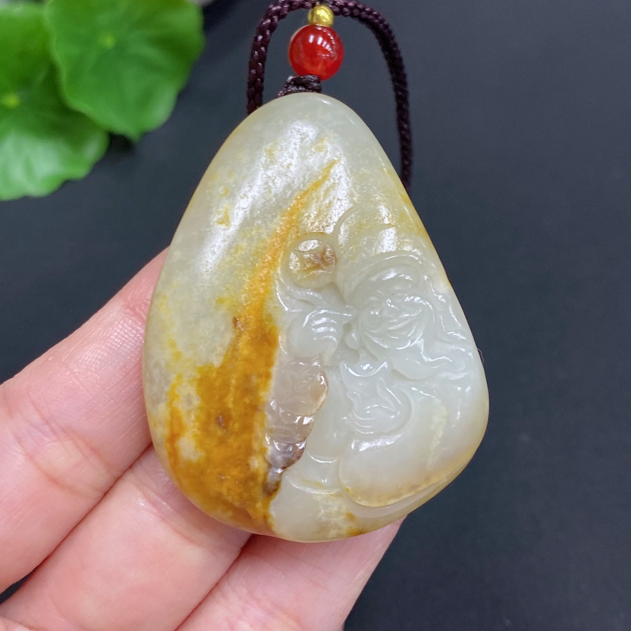 Hetian Jade Pendant    God of Wealth    Total Weight (including rope): 35.1g    Undetermined skin color cause