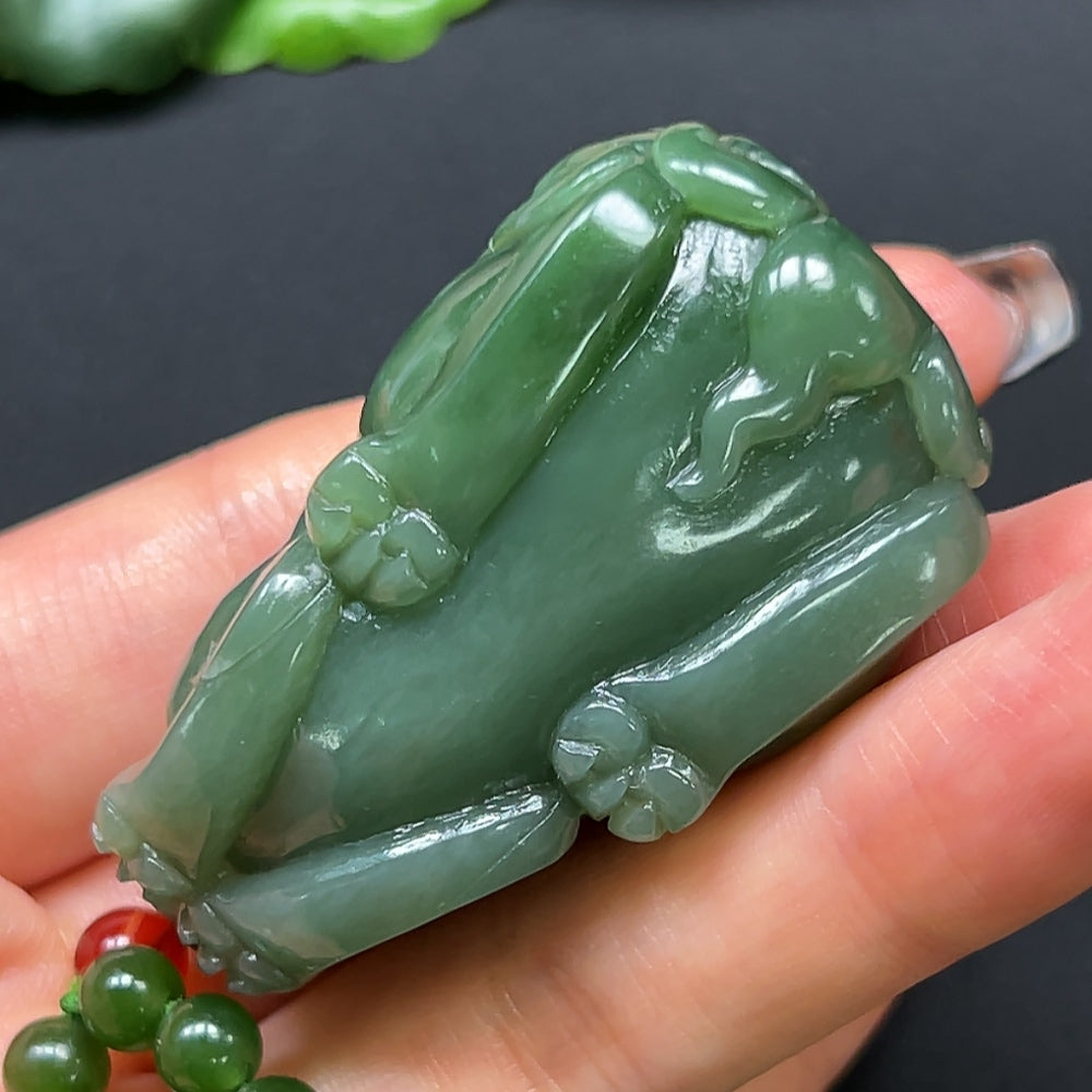 Hetian jade Pi Xiu pendant with chain, featuring an intricate carved design and weighing approximately 109 grams.
