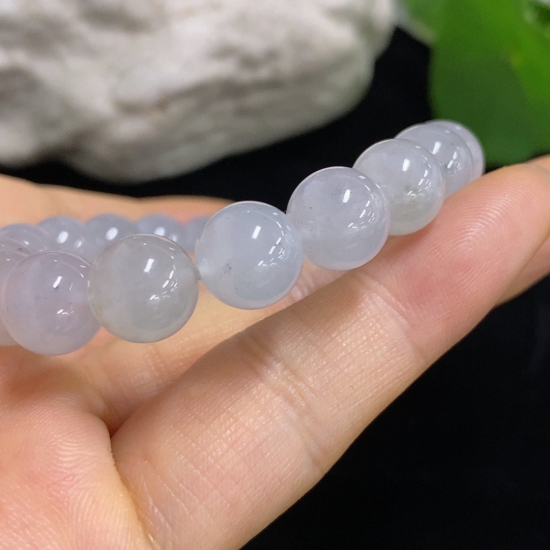 HKHQ Jadeite bracelet with 9.6mm beads, weighing approximately 31.93g, featuring smooth, polished jadeite stones.