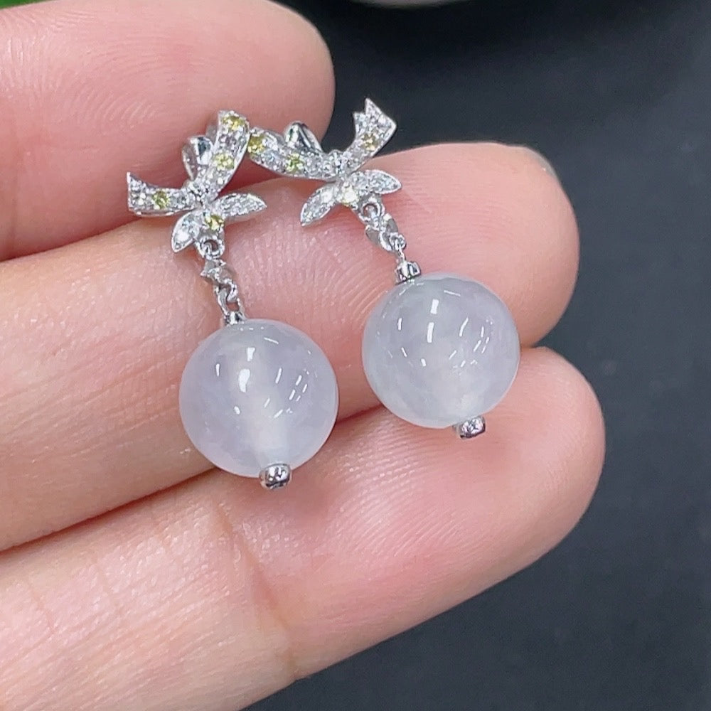 Jadeite earrings set in 18k gold with diamond accents, total product weight approximately 3.07g