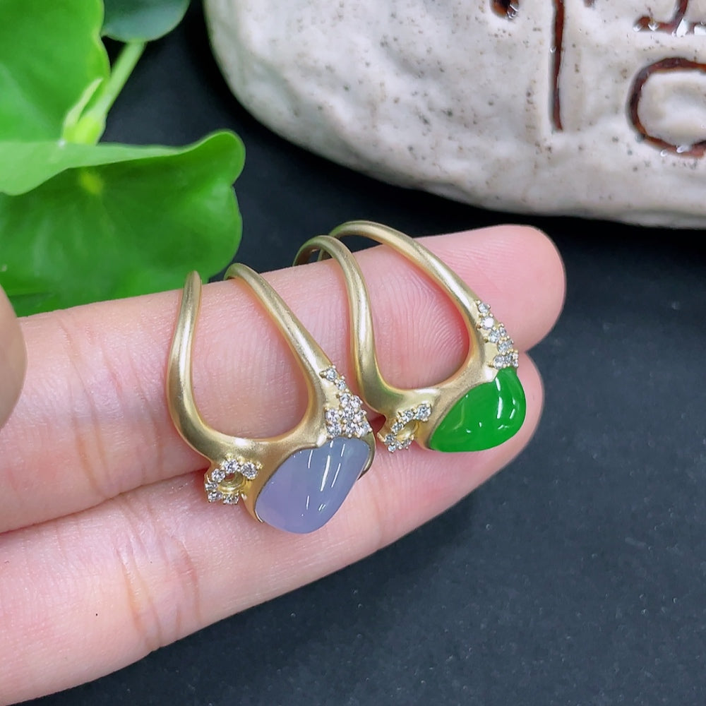 Jadeite inlaid ring with unmarked 18k gold band and diamond accents, weighing approximately 6.7g, featuring intricate craftsmanship.