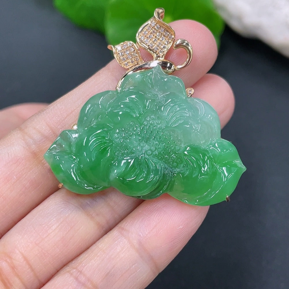 Jadeite flowering prosperity pendant with 18k gold and diamond accents, featuring intricate floral inlay and detailed craftsmanship.