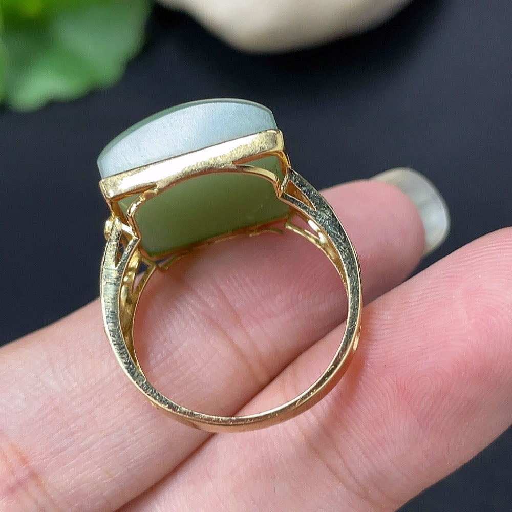 Elegant Hetian jade inlaid ring by HKHQ with diamond accents in 18K gold, showcasing intricate craftsmanship and luxurious design.