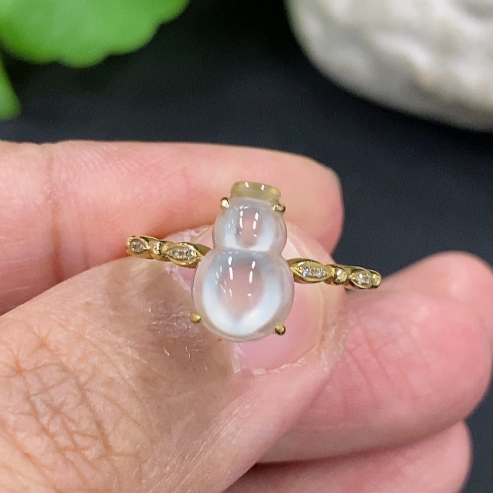 Jadeite gourd-shaped ring with 18K gold band from HKHQ, featuring a smooth, polished jadeite stone and elegant design.