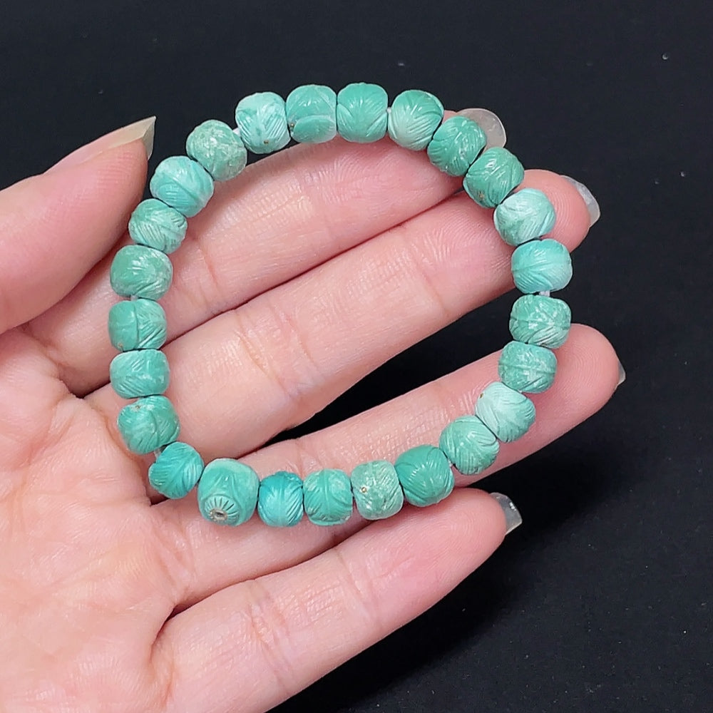 Turquoise gemstone bracelet by HKHQ featuring small metal links, approximately 7.4mm, with a total weight of 11.29g.
