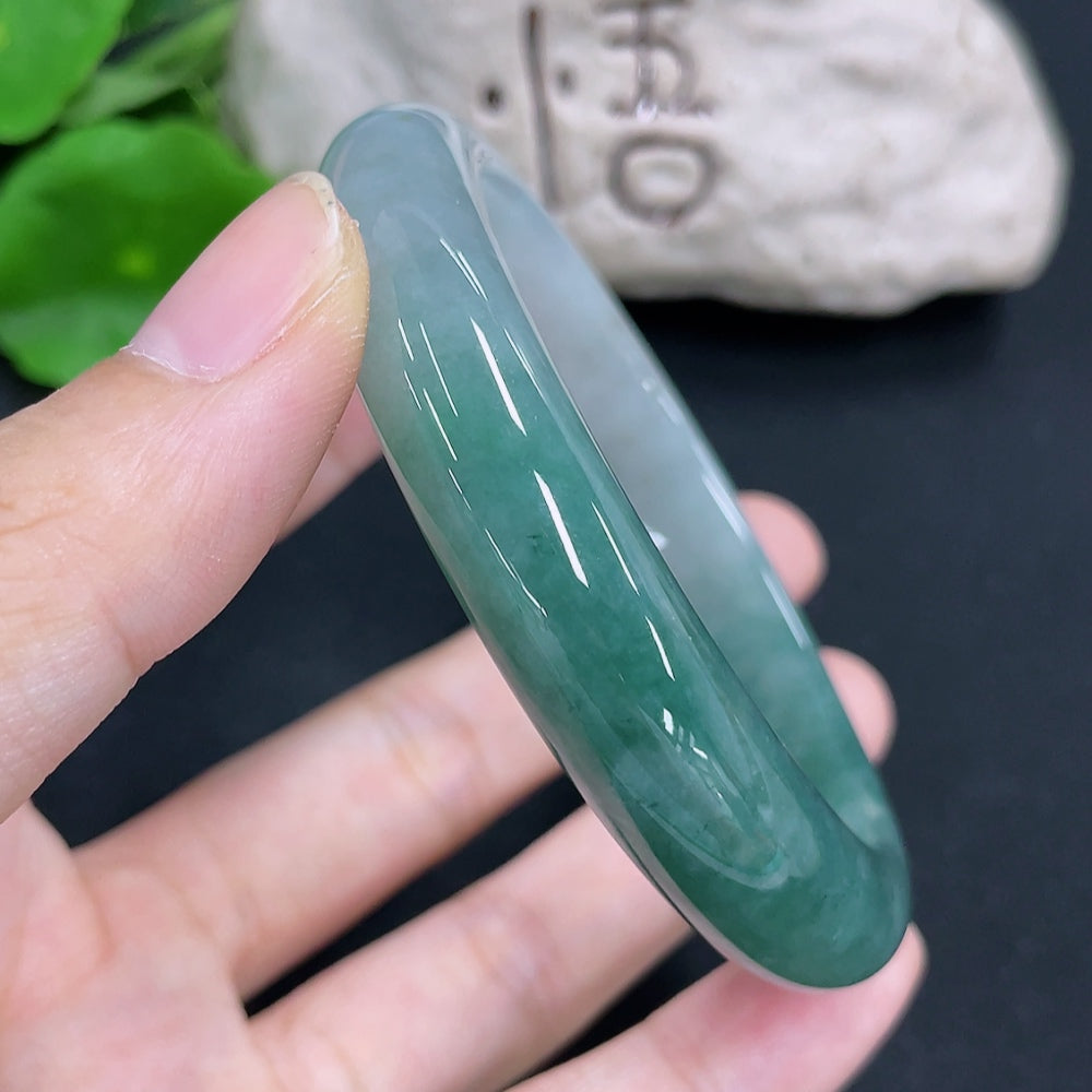 HKHQ jadeite round bangle, approximately 58.9g, size 58.8, smooth green jade jewelry with polished finish.