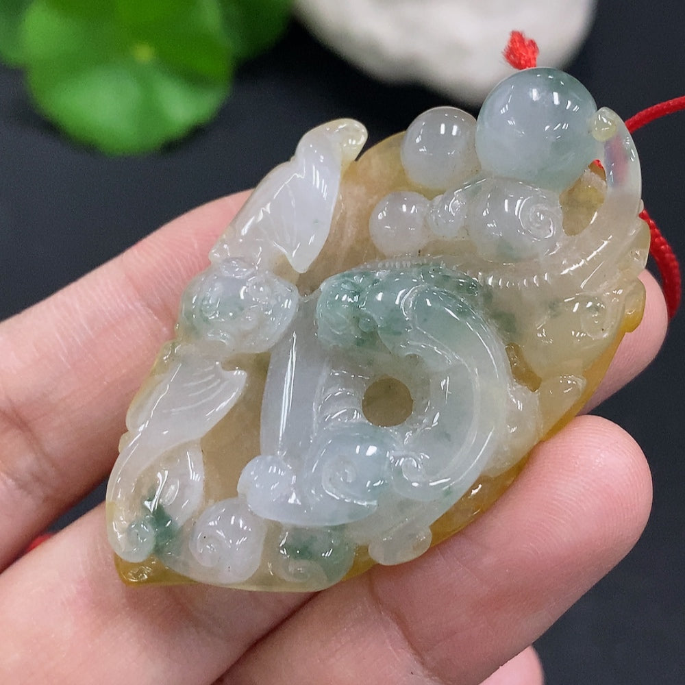 Jadeite pendant with cord, total weight approximately 25.2g (color origin undetermined)