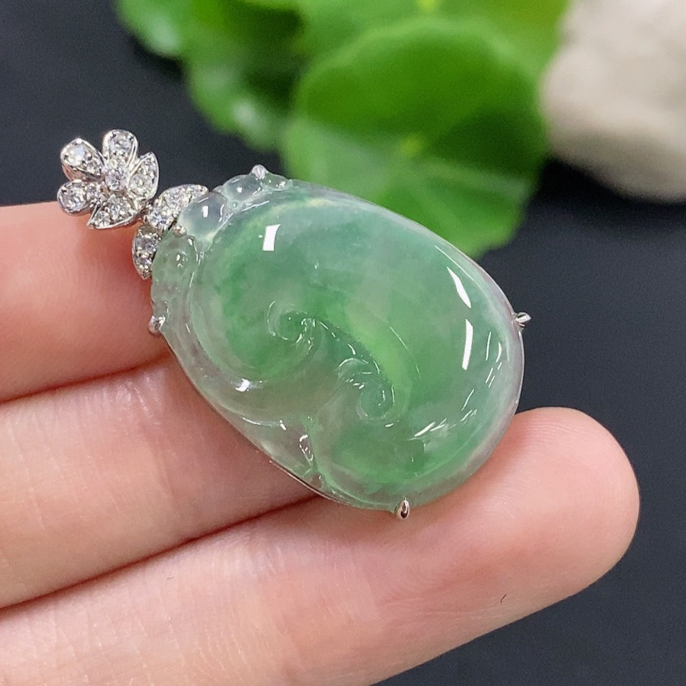 Jadeite Ruyi pendant with 18K gold and diamond accents, showcasing intricate inlay work and a polished jade surface.