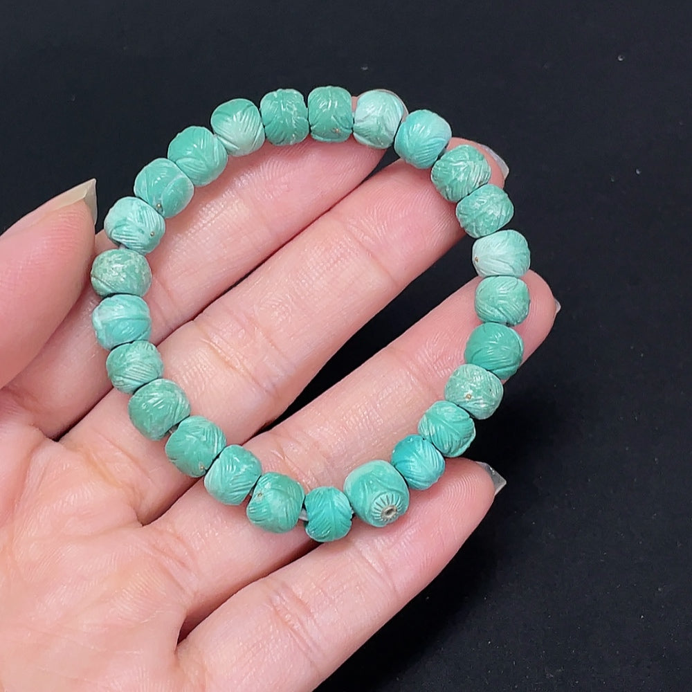 Turquoise gemstone bracelet with small metal links, approximately 7.4mm in size, from HKHQ, showing close-up of the colorful stones.